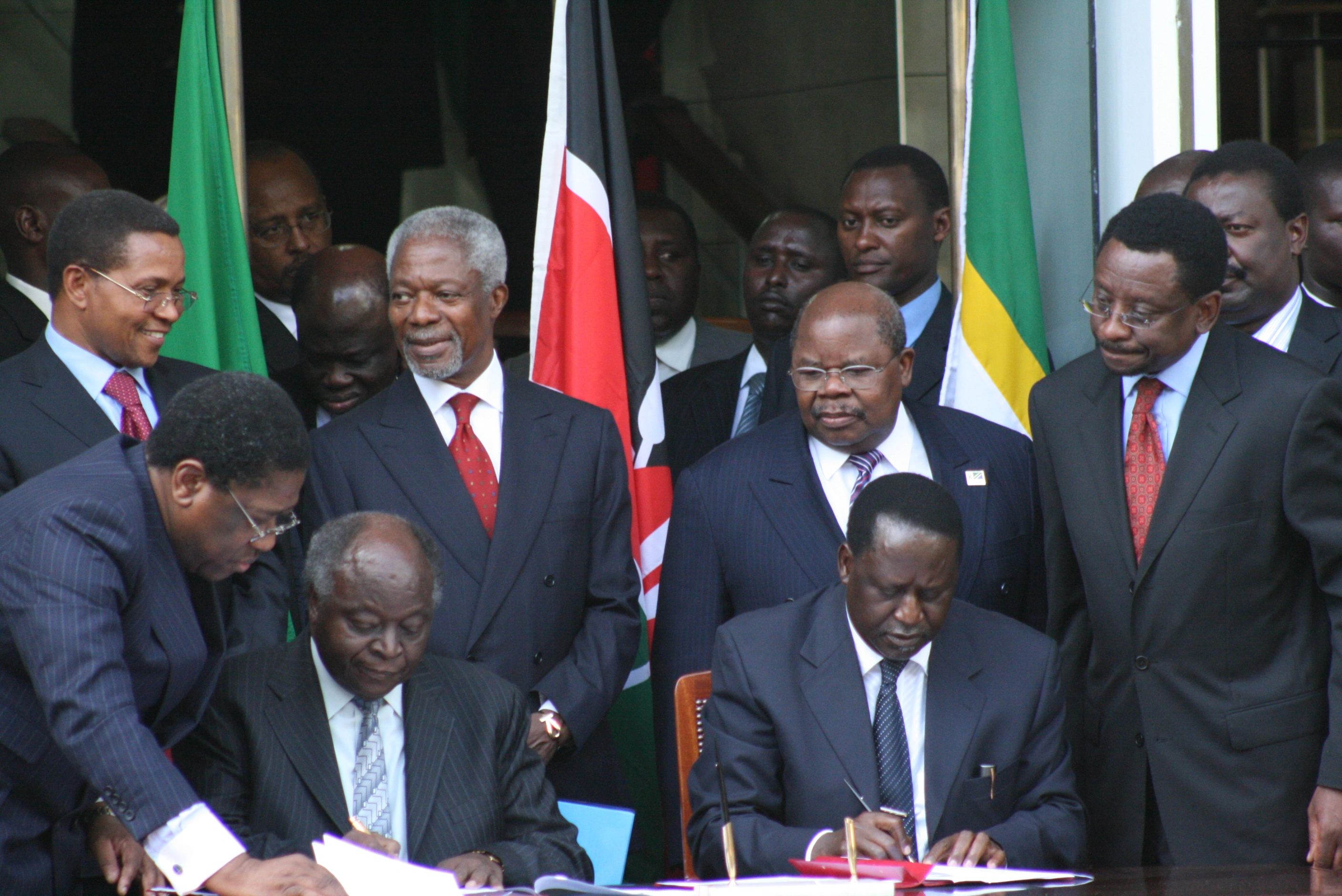2007 elections_President Mwai Kibaki and opposition leader Raila Odinga signing the Power Sharing Deal at Harambee House Nairobi 28.2.2008