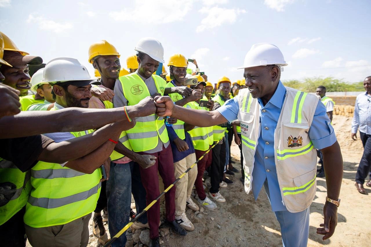 President William Ruto interacting with construction workers after laying the foundation stone for the 302-unit archer's post affordable housing project in Samburu_10.11.2025