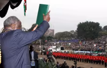 President Mwai Kibaki waving the New Constitution on Promulgation Day at Uhuru Park Nairobi 1