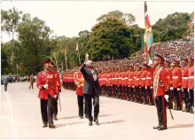 President Daniel Arap Moi salutes the Kenya Armed Forces flag during a guard of honour mounted on Madaraka Day Celebrations at Uhuru Park Nairobi