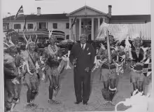 President Jomo Kenyatta being entertained by Kikuyu traditional dancers